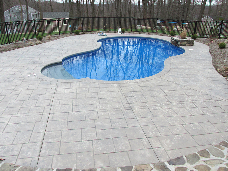 Swimming pool and stamped concrete project example 22